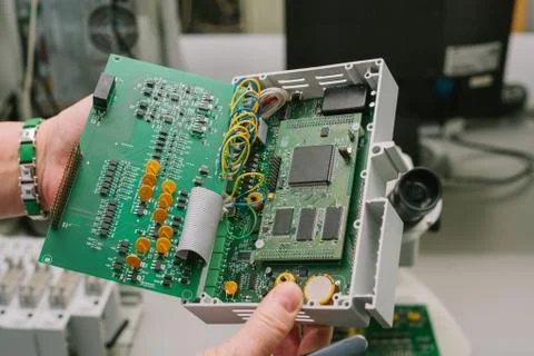 Computer expert professional technician examining board computer in a laboratory Foto stock
