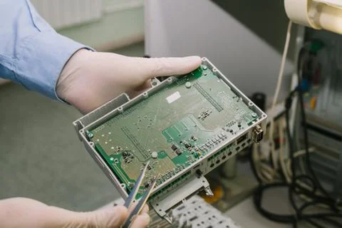 Computer expert professional technician examining board computer in a laboratory Foto stock
