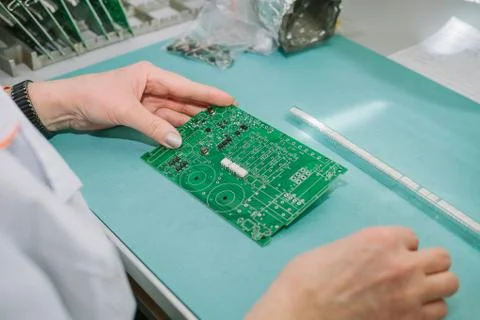 Computer expert professional technician examining board computer in a laboratory Stock Photos