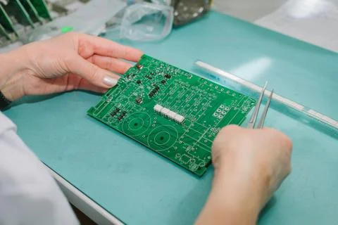 Computer expert professional technician examining board computer in a laboratory Foto stock