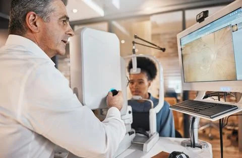 Computer, eye exam or black woman consulting doctor to help with eyesight at Stock Photos