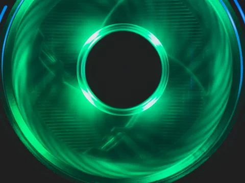 Computer fan with green light close up. cooler in action with leds. power in  Stock Photos