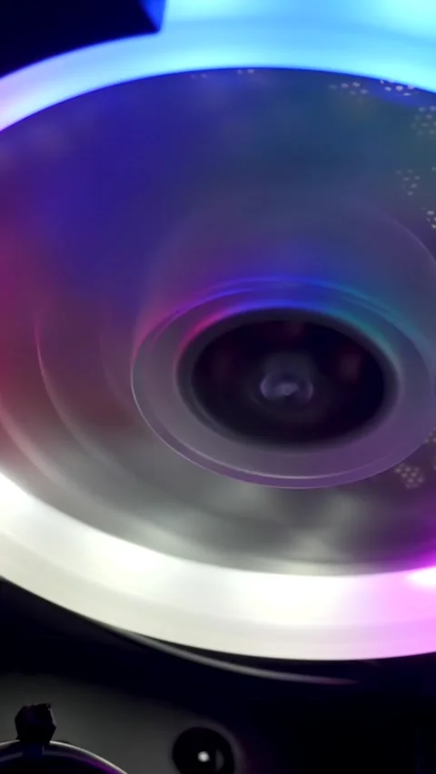 Computer fan rotate inside PC case with colorful RGB LED light glow Stock Footage 347731004