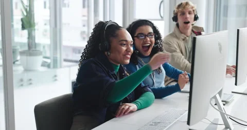 Computer, fist pump and surprise with friends in call center together for Stock Footage 314092698