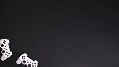 Computer game competition. Gaming concept. White joysticks on a black background Stock Footage 137696293