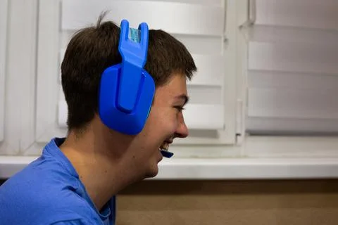 Computer game player is spurred on by his friend action. Good laugh in vide.. Stock Photos