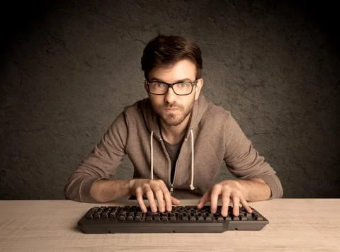Computer geek typing on keyboard Stockfoto's