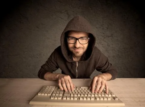 Computer geek typing on keyboard Stockfoto's