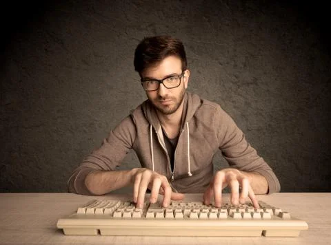 Computer geek typing on keyboard Foto stock