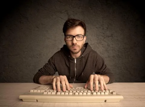 Computer geek typing on keyboard Foto stock