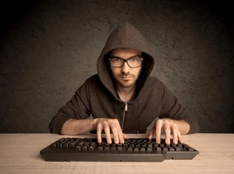 Computer geek typing on keyboard 스톡 사진