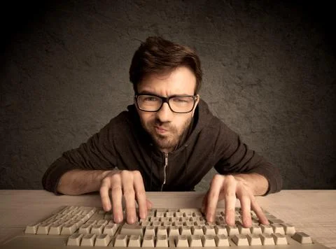 Computer geek typing on keyboard Foto stock