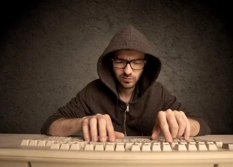 Computer geek typing on keyboard Stockfoto's