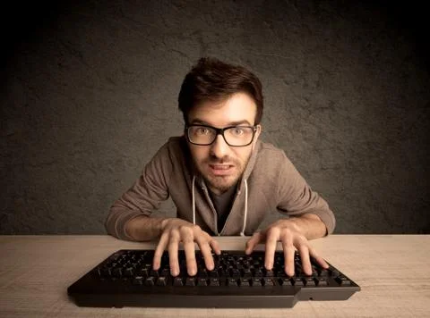 Computer geek typing on keyboard Stockfoto's