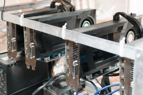 Computer with graphic graphics cards for e-currency mining. Mining rig. Stock Photos