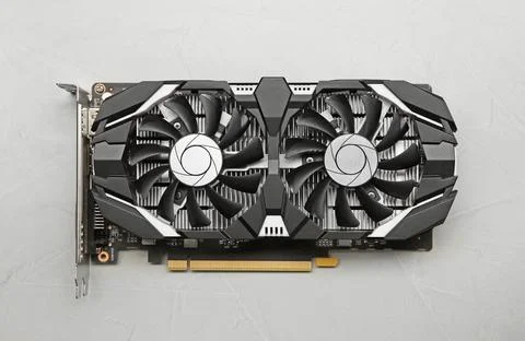 Computer graphics card on gray textured background, top view Stock Photos