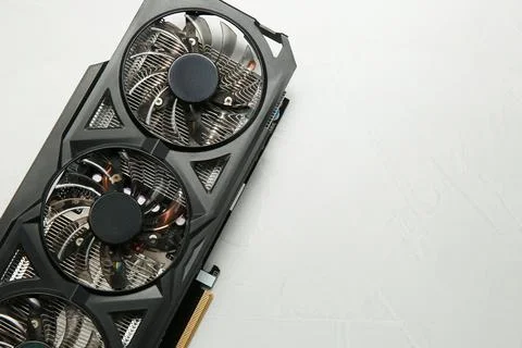 Computer graphics card on gray textured background, top view. Space for text Stock Photos