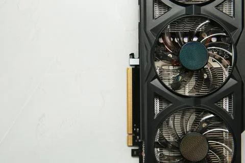 Computer graphics card on gray textured background, top view. Space for text Stock Photos