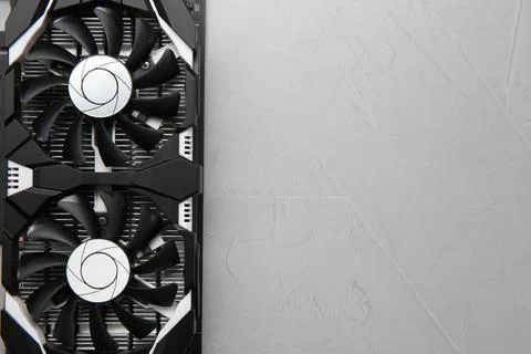 Computer graphics card on gray textured background, top view. Space for text Foto stock