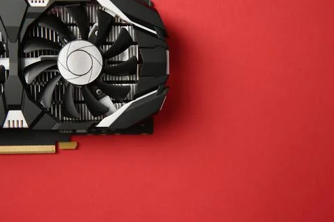 Computer graphics card on red background, top view. Space for text Foto stock