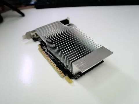 Computer graphics card, standing on a white desk, close up Stock Photos