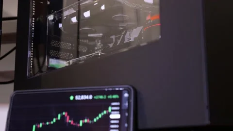 Computer graphics card used to mine crypto currency, crypto mining, cell phone Stock Footage 153497227