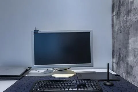 A computer graphics desk, a wireless mouse and a pen for drawing on the des.. Stock Photos