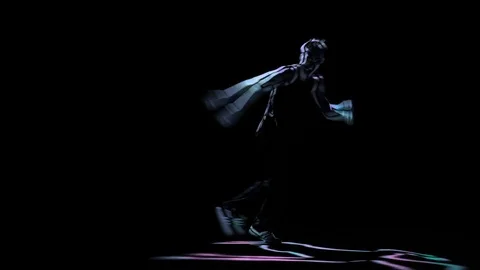Computer graphics, silhouette man perform brake dance on black background Stock Footage