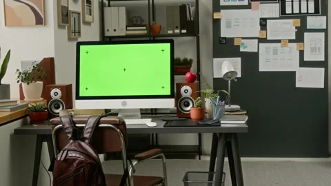 Computer with Green Screen on Desk of UX Engineer at Mobile App Company Stock Footage 327903173