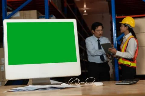 Computer with green screen display in warehouse storage room Stock Photos