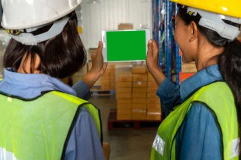 Computer with green screen display in warehouse storage room Stock Photos