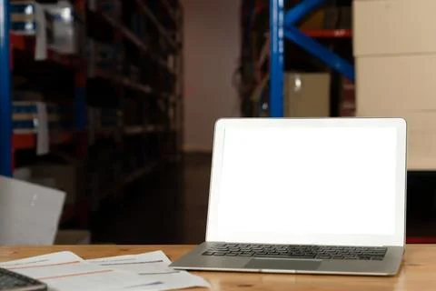 Computer with green screen display in warehouse storage room Foto stock