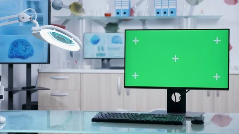 Computer with green screen mock up on doctor desk Stockbeeldmateriaal 110898903