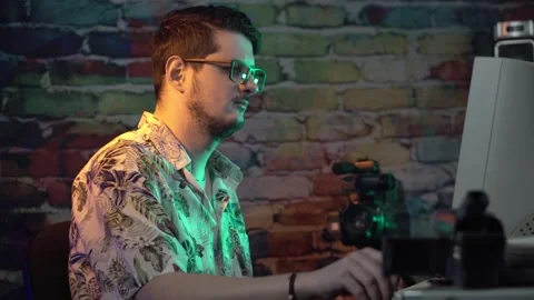 Computer Guy From 2000's Placing CD DVD in Box and Smoking Cigarette at Desk Stock Footage 306141862