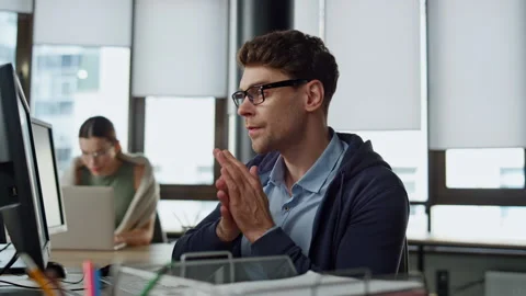 Computer guy looking screen on office. Thoughtful engineer checking code problem Stock Footage 242984735
