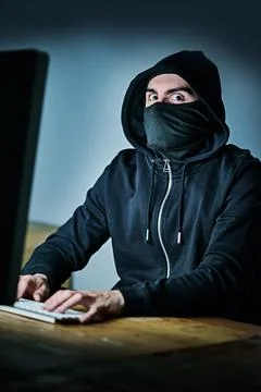 Computer, hacker and portrait of man at night for cyber attack, fraud and Stock Photos