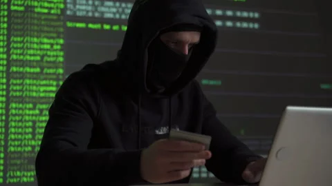 Computer hacker with credit card stealing data from a laptop concept for network Stock Footage 133899877