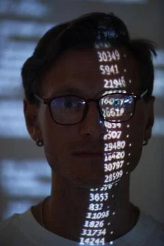 Computer hacker examining numbers Foto stock