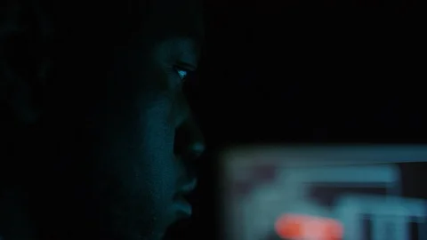 Computer hacker finished uploading software on one of his dual screens in the da Stock Footage 101504216