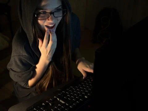 Computer hacker girl stealing information with laptop Foto stock
