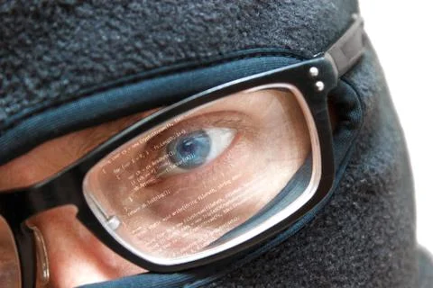 Computer hacker in glasses wear anonymous mask to make cyber crime action Stock Photos