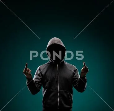 Computer hacker in hoodie. Obscured dark face. Data thief, internet fraud Stock Photos