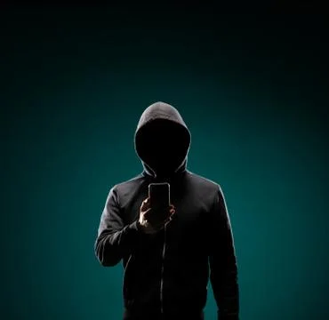 Computer hacker in hoodie. Obscured dark face. Data thief, internet fraud Foto stock
