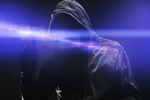 Computer hacker in hoodie using virtual screen. Database hacking, computer .. Stock Photos