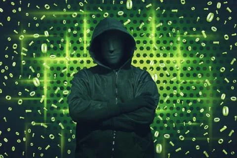 Computer hacker with mask standing Stock-Fotos