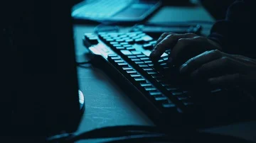 Computer Hacker at Night Breaking Code Stock Footage