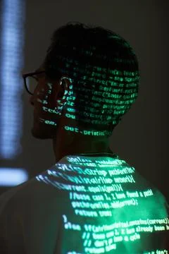 Computer hacker reading a code Stock Photos