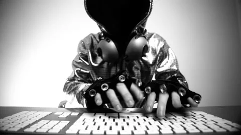 Computer hacker in silver jacket Stock Footage 144599802