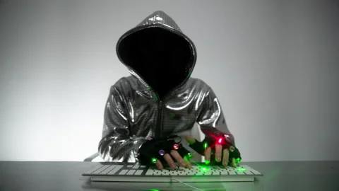 Computer hacker in silver jacket Stock Footage 144599994