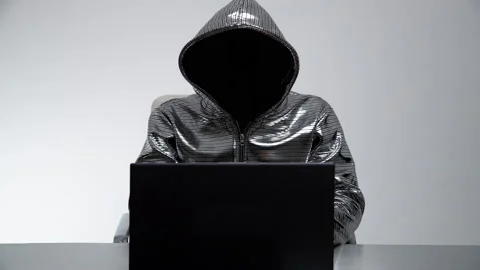 Computer hacker in silver jacket Stock Footage 144771766